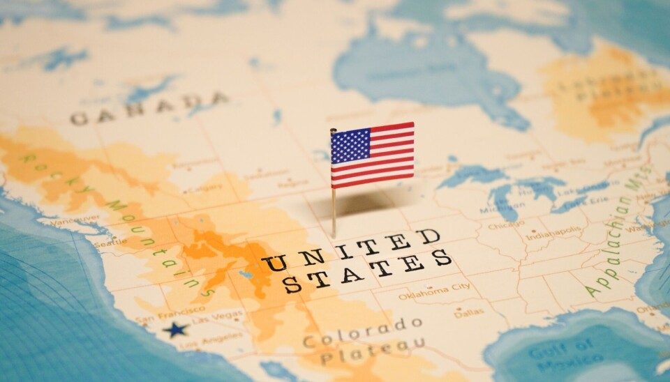 A map of the United States with a small American flag marker
